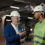 Men in hardhats speaking