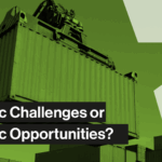 Man working on a laptop in a warehouse