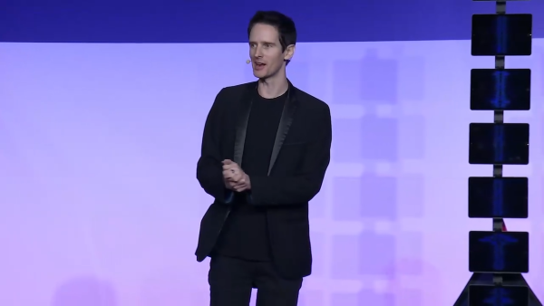 Speaker discussing magic